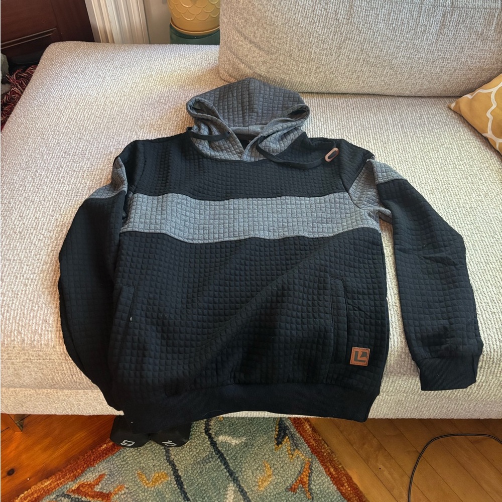 Black and gray hoodie with pockets (unsure of brand)